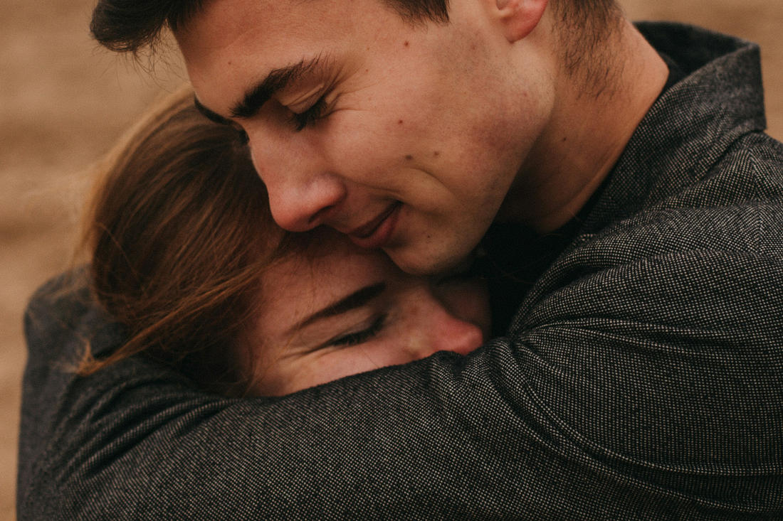 Couple in love hugging each other outside